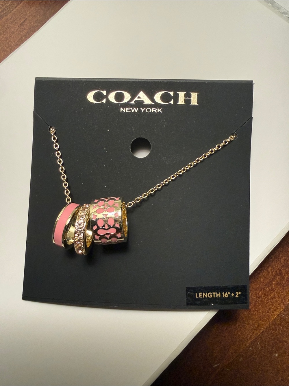 Coach Gold-Tone Necklace with Pink Enamel Ring Trio